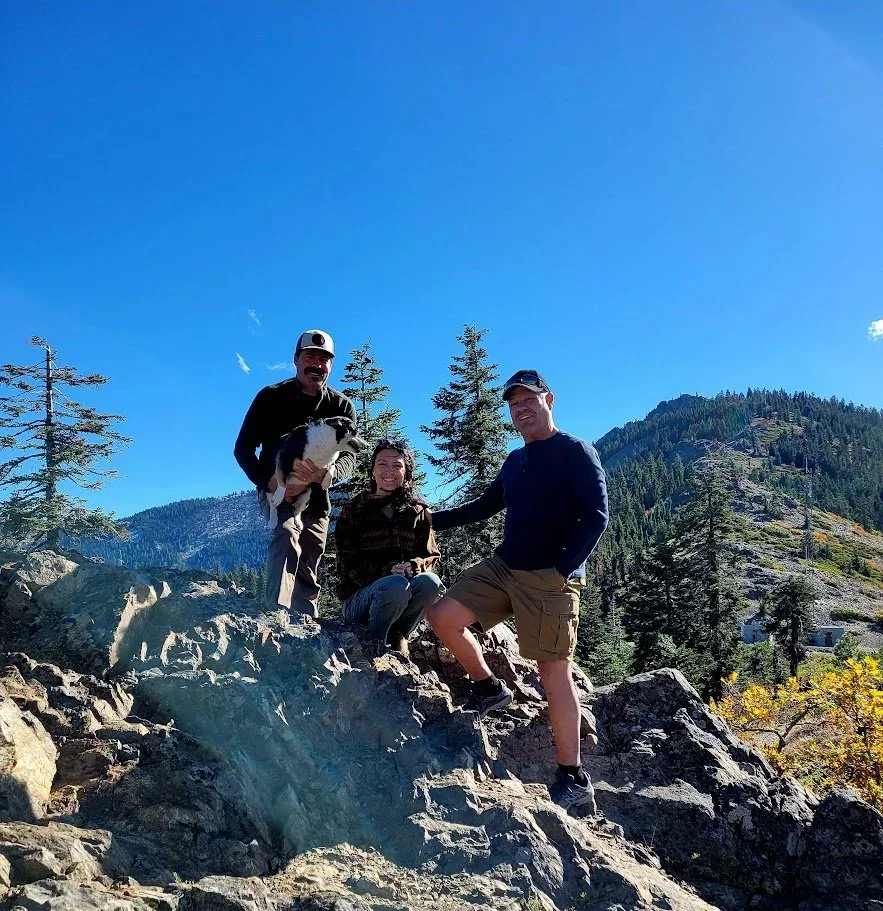 A community of friends together on a mountain trail